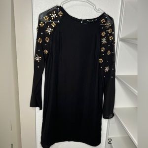 Dress with embellished sleeves